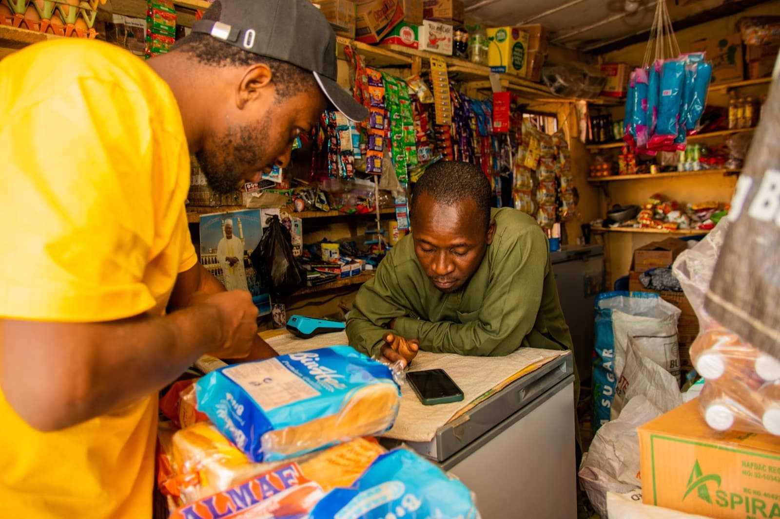 An agent registering a provisions shop owner