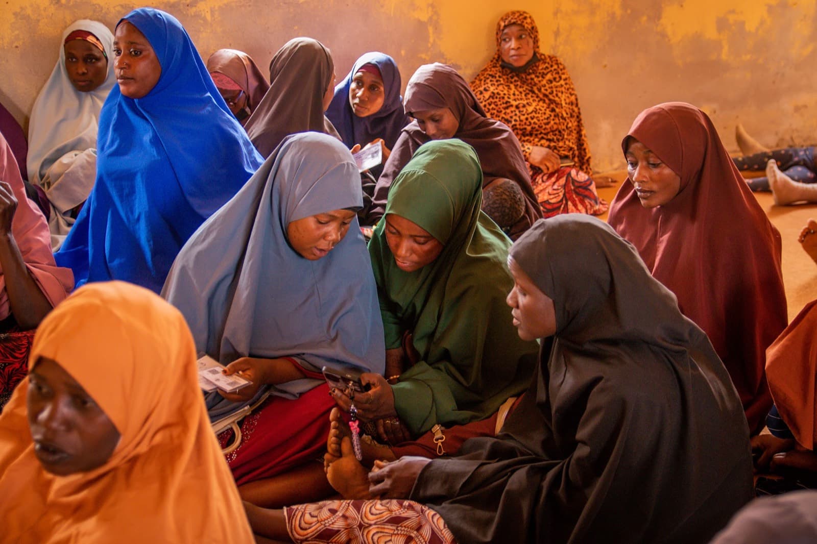 Women seated together during a circle onboarding session