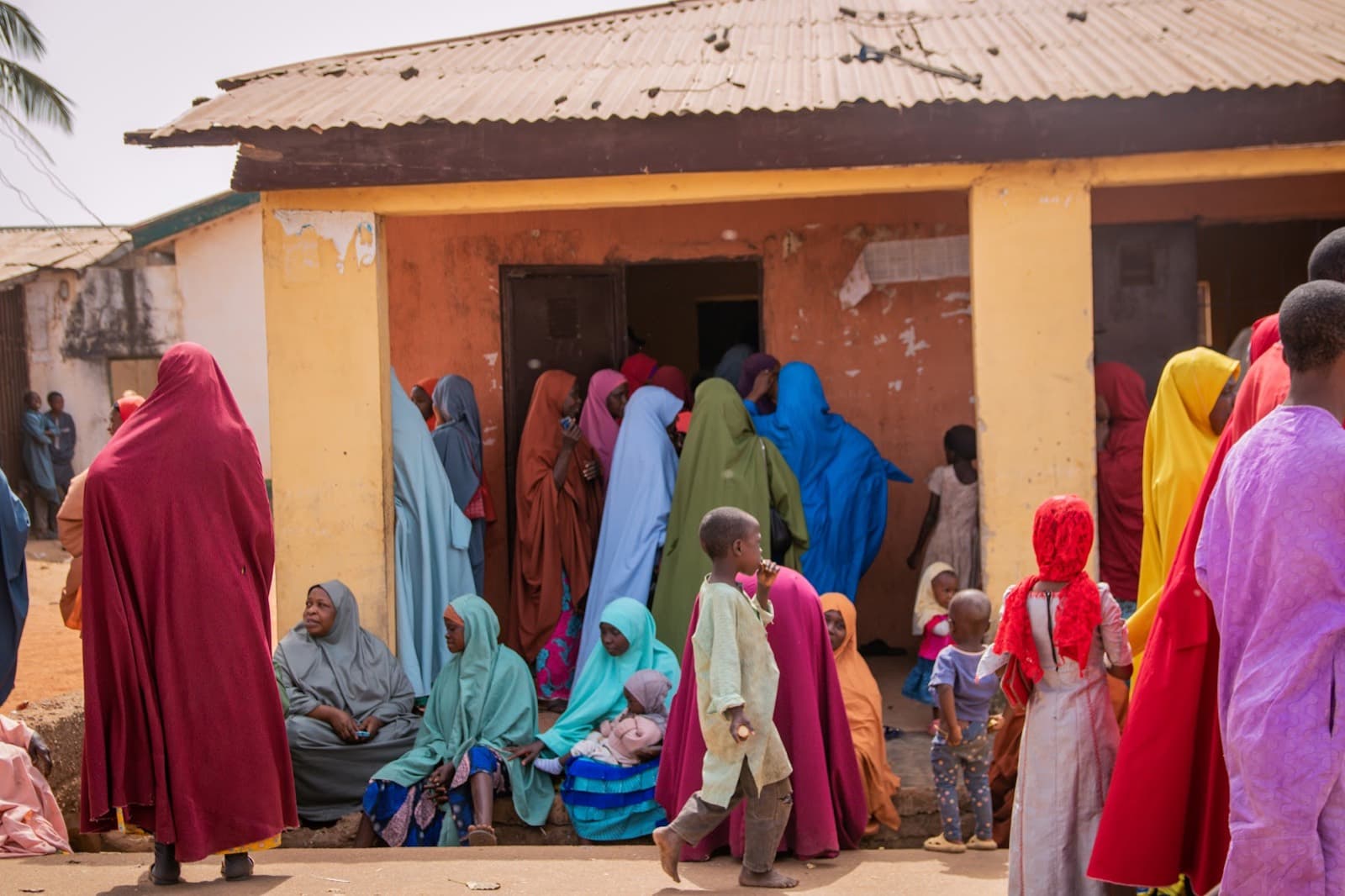 Women arriving for onboarding outside the venue