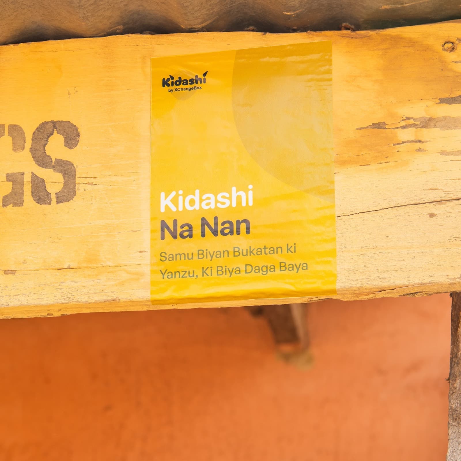 A 'Kidashi Na Nan' sign on a vendor's shop
