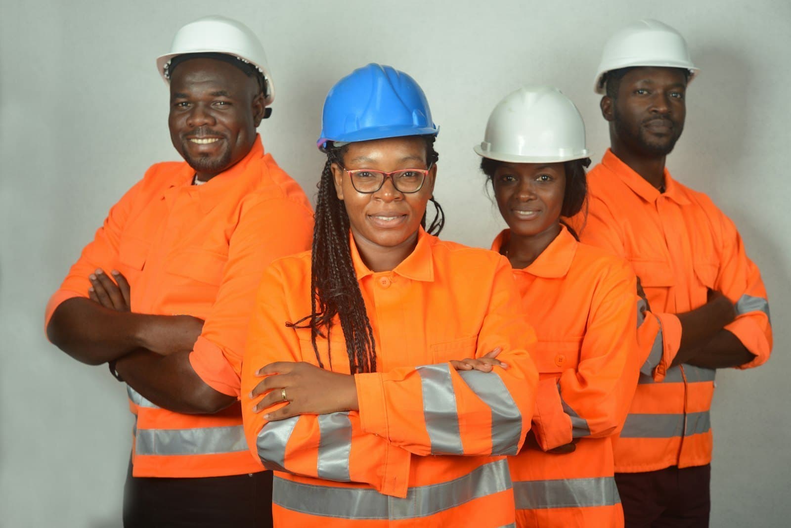 Plant engineers in hard hats and high-visibility overalls